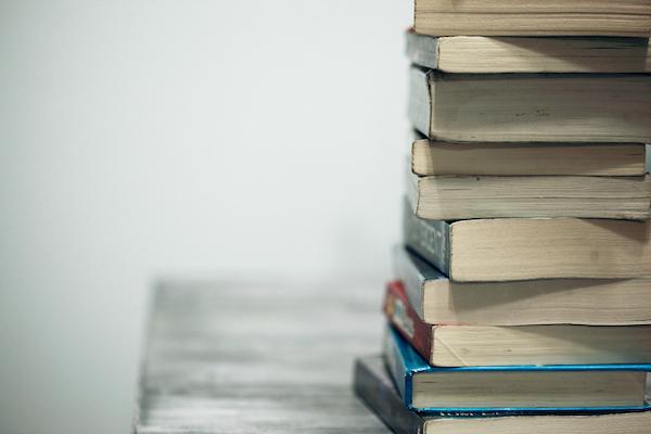 Books indicating study in remedial massage